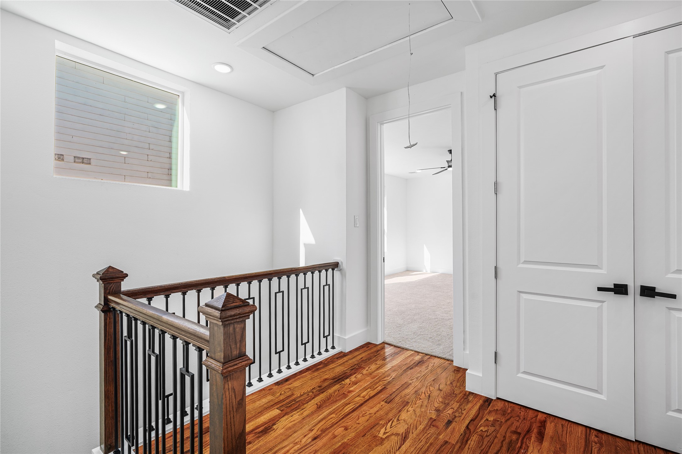 3405 Baer Street Houston, TX 77020 - Photo 15 of 28 a view of a hallway with wooden floor and closet area