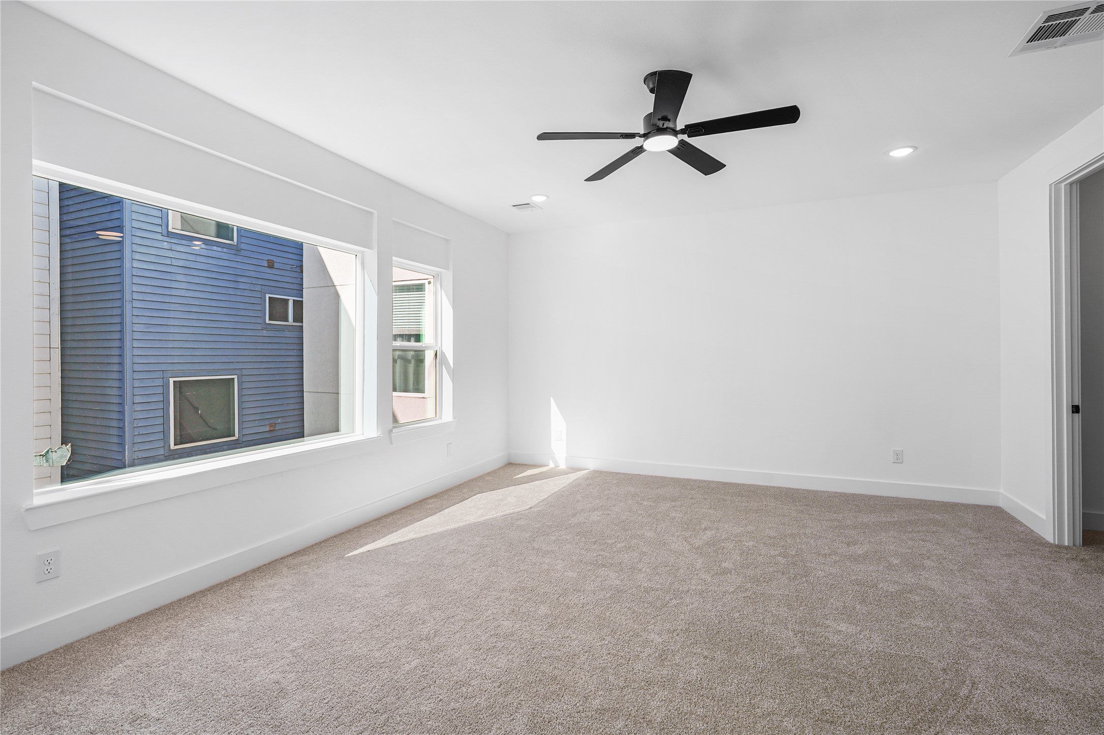 3405 Baer Street Houston, TX 77020 - Photo 16 of 28 a view of a livingroom with a ceiling fan and window