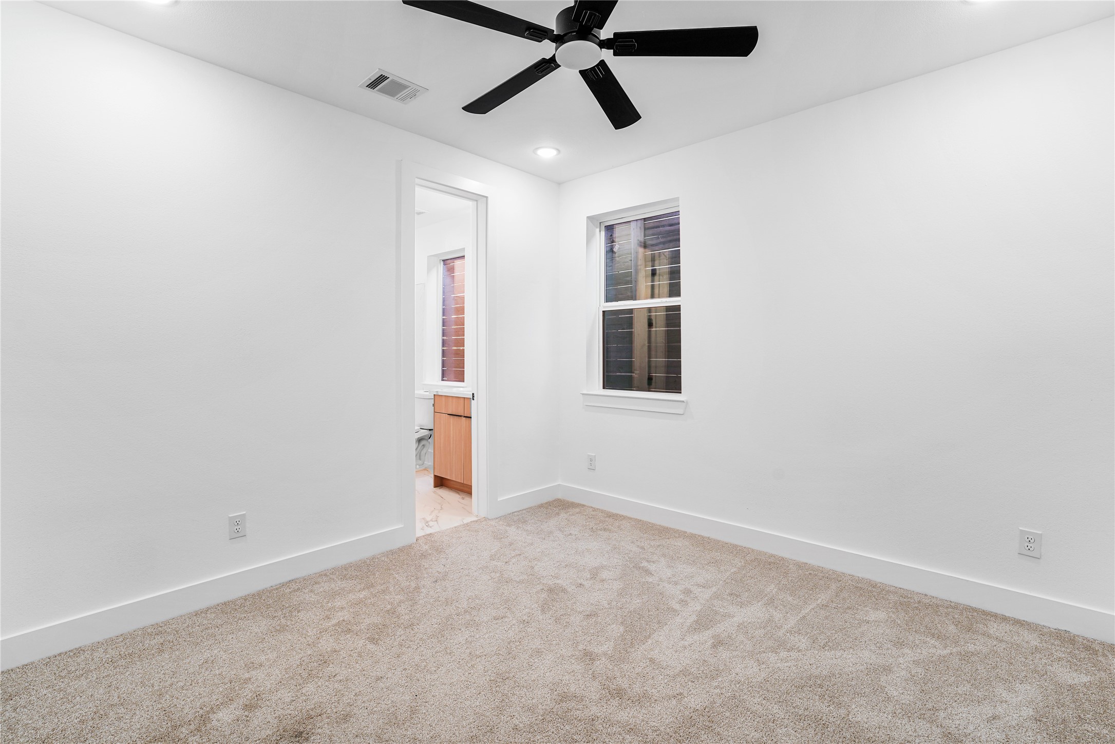 3405 Baer Street Houston, TX 77020 - Photo 18 of 28 a view of an empty room with a window