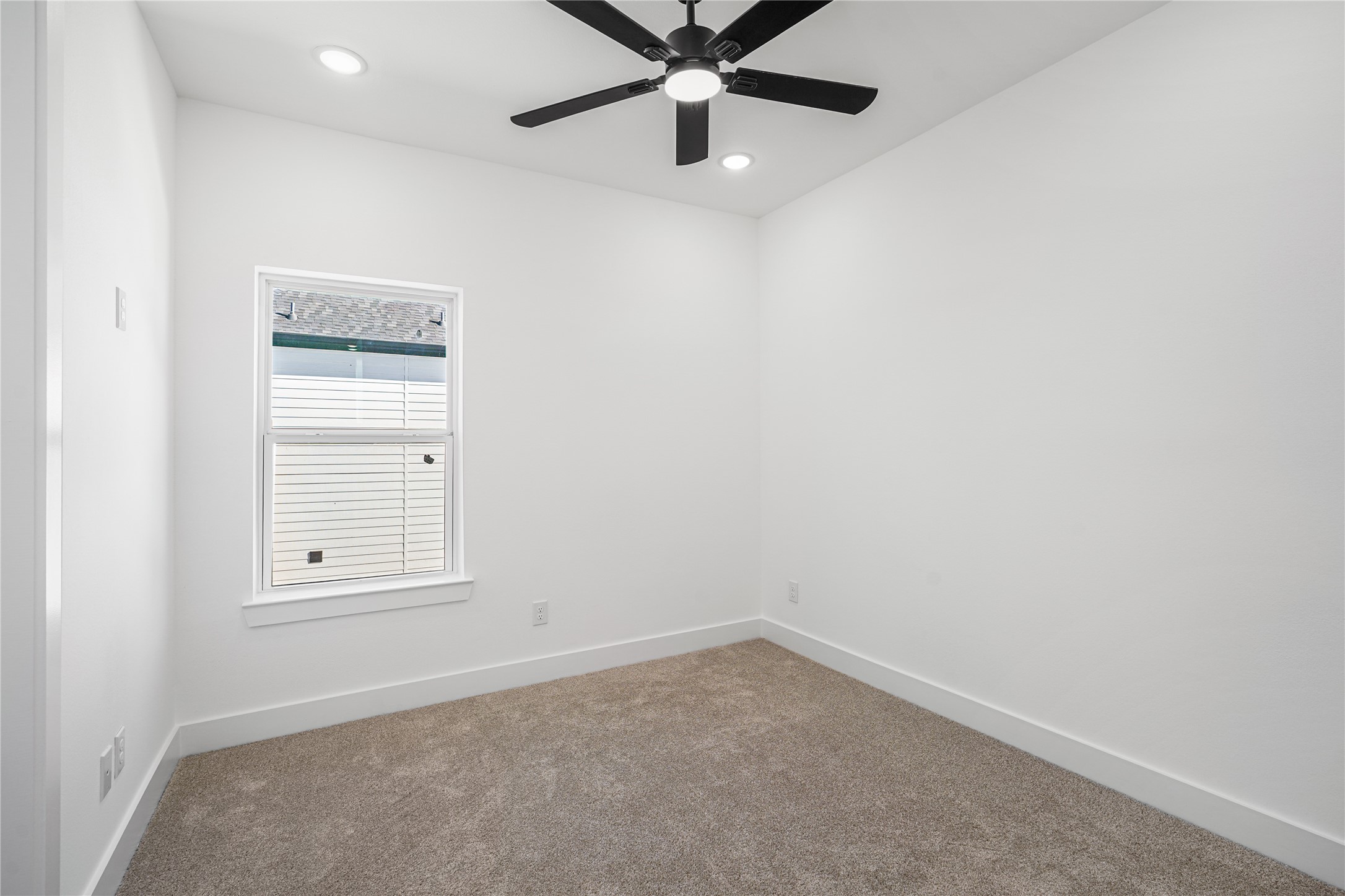 3405 Baer Street Houston, TX 77020 - Photo 20 of 28 an empty room with a window and a fan