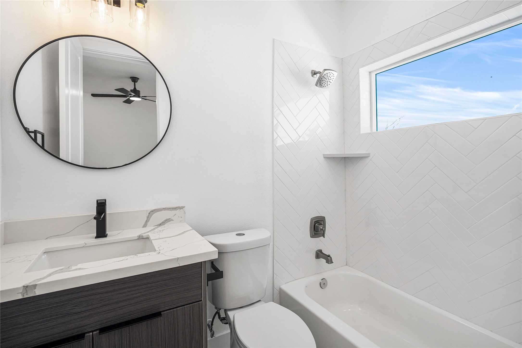 3405 Baer Street Houston, TX 77020 - Photo 22 of 28 a bathroom with a sink a toilet and a mirror