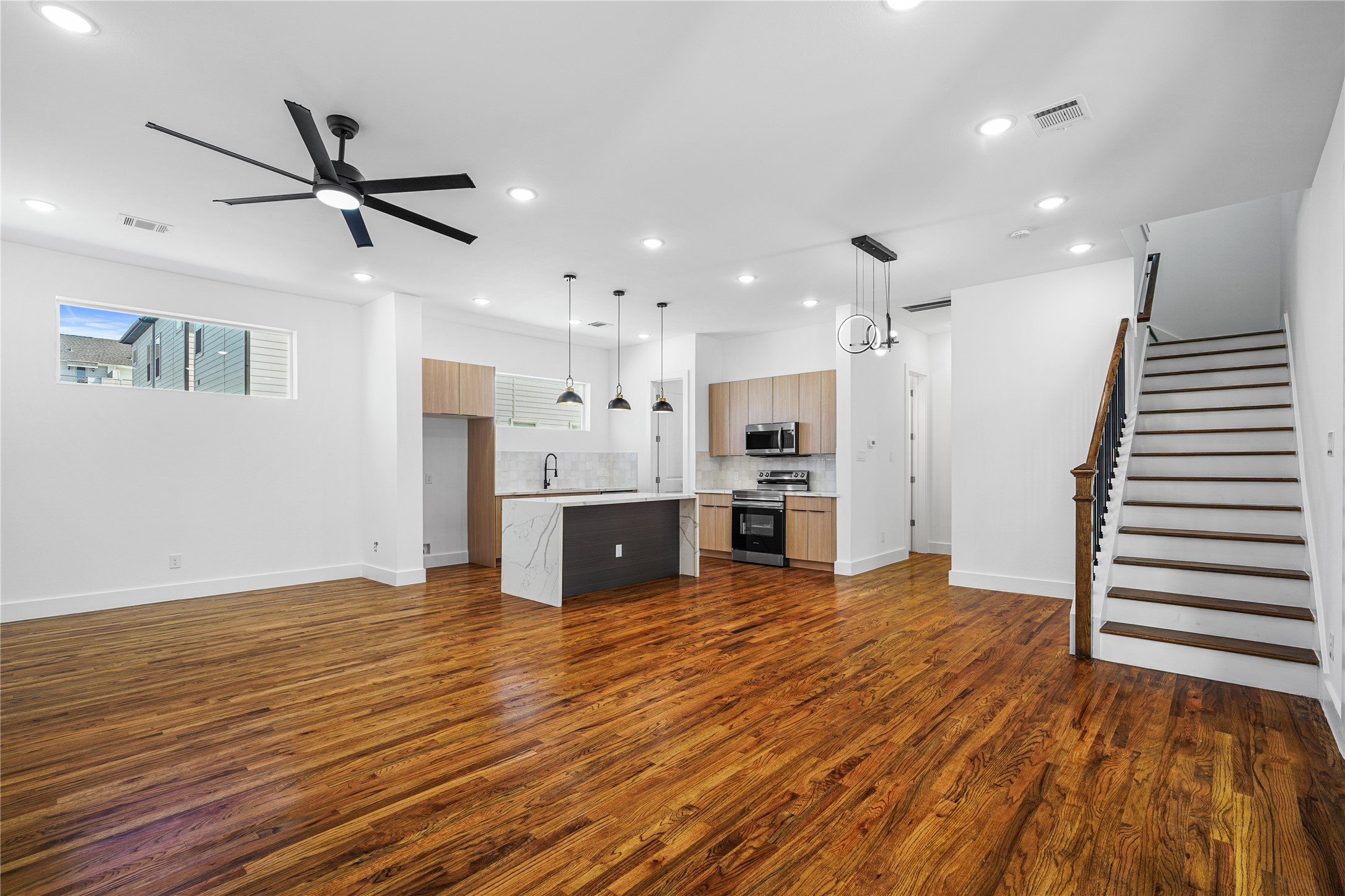 3405 Baer Street Houston, TX 77020 - Photo 3 of 28 a view of kitchen with wooden floor and window