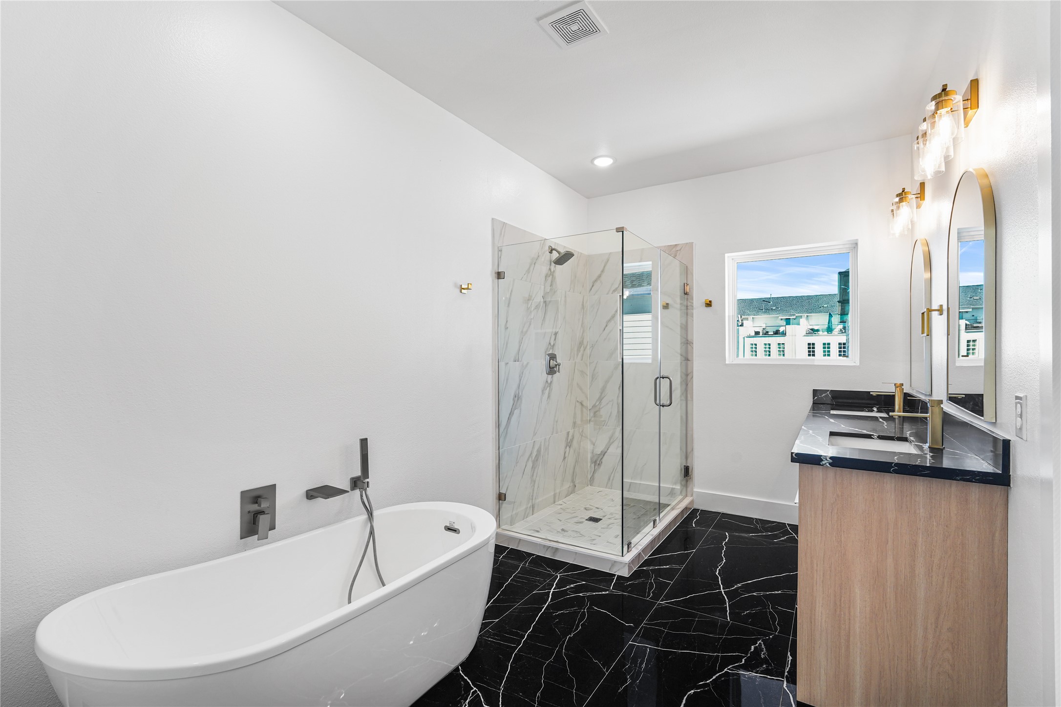 3405 Baer Street Houston, TX 77020 - Photo 4 of 28 a bathroom with a bathtub shower sink mirror and toilet