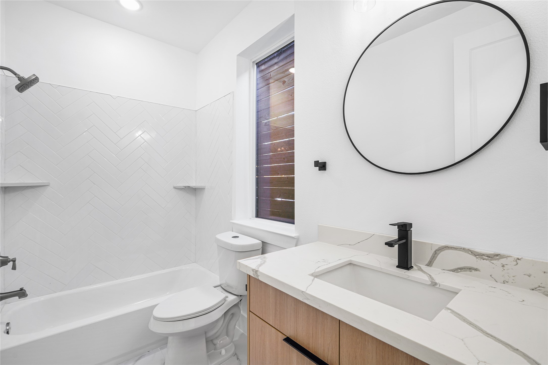 3405 Baer Street Houston, TX 77020 - Photo 8 of 28 a bathroom with a sink a toilet and a mirror