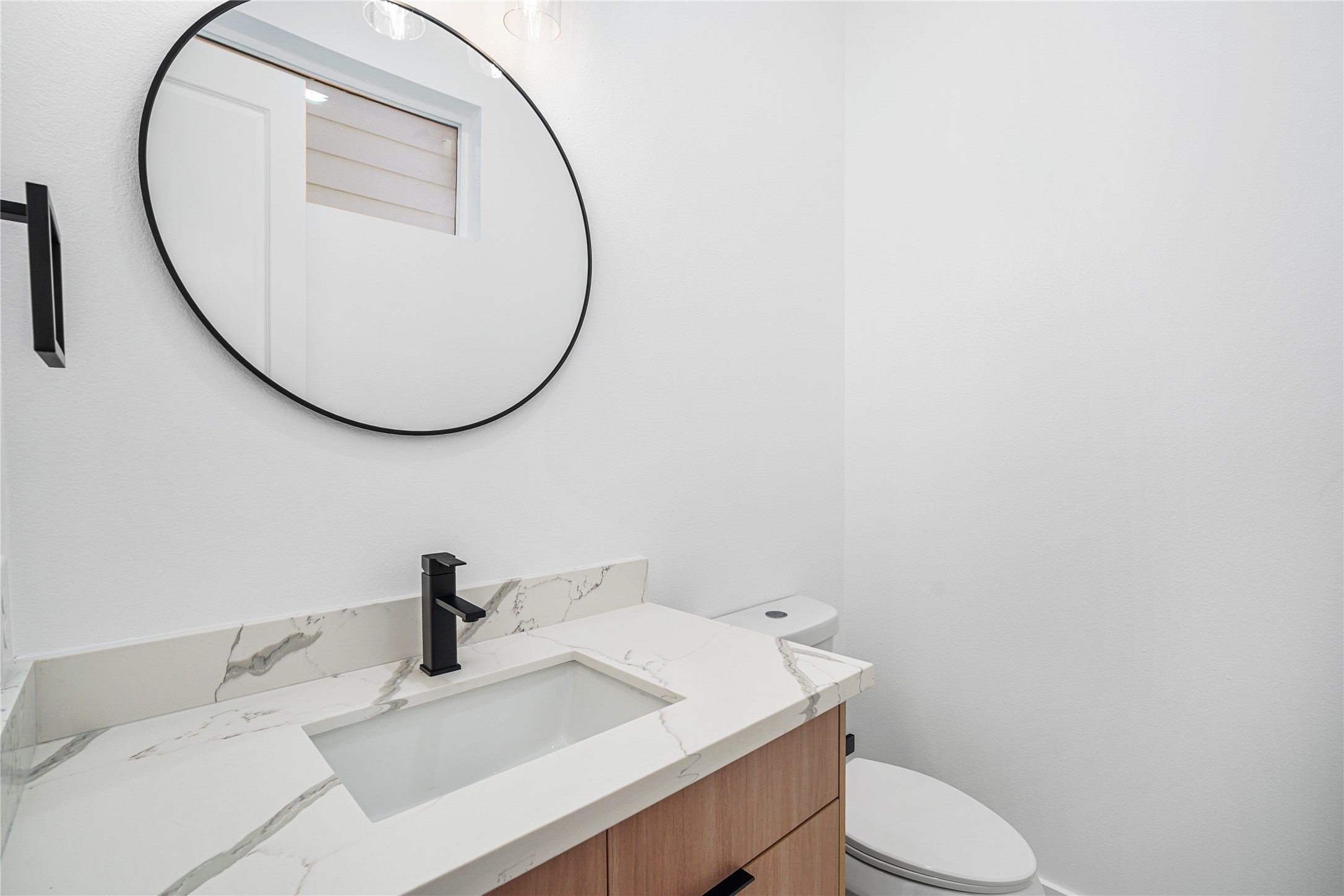 3405 Baer Street Houston, TX 77020 - Photo 10 of 28 a bathroom with a sink and a mirror