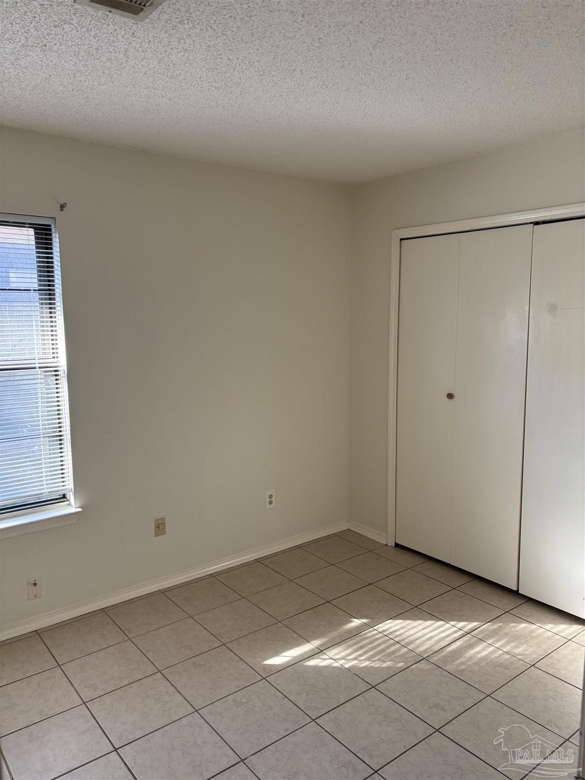 3145 Cedarwood Village Lane Pensacola, FL 32514 - Photo 11 of 11 an empty room with windows