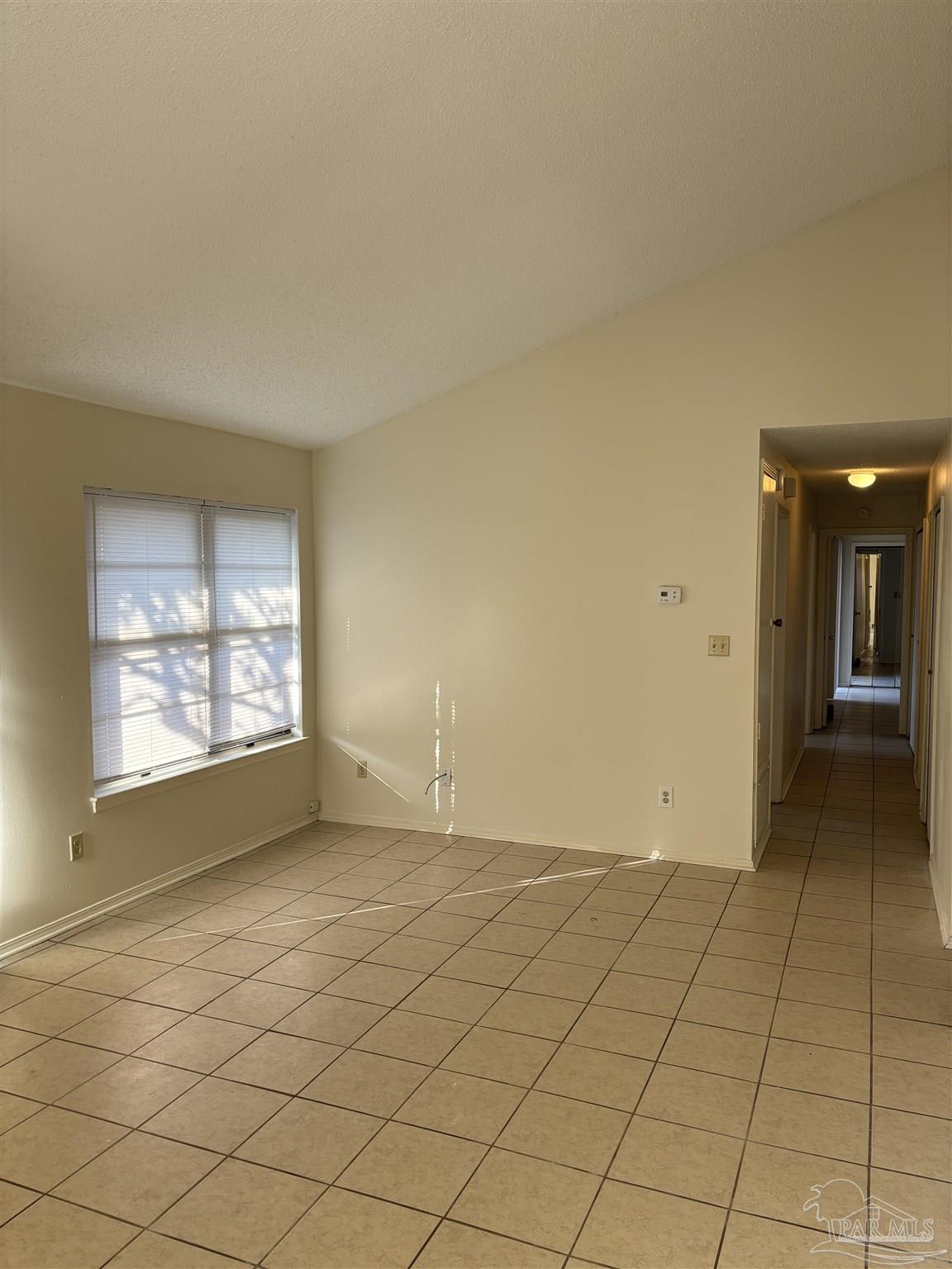 3145 Cedarwood Village Lane Pensacola, FL 32514 - Photo 2 of 11 a view of an empty room and window