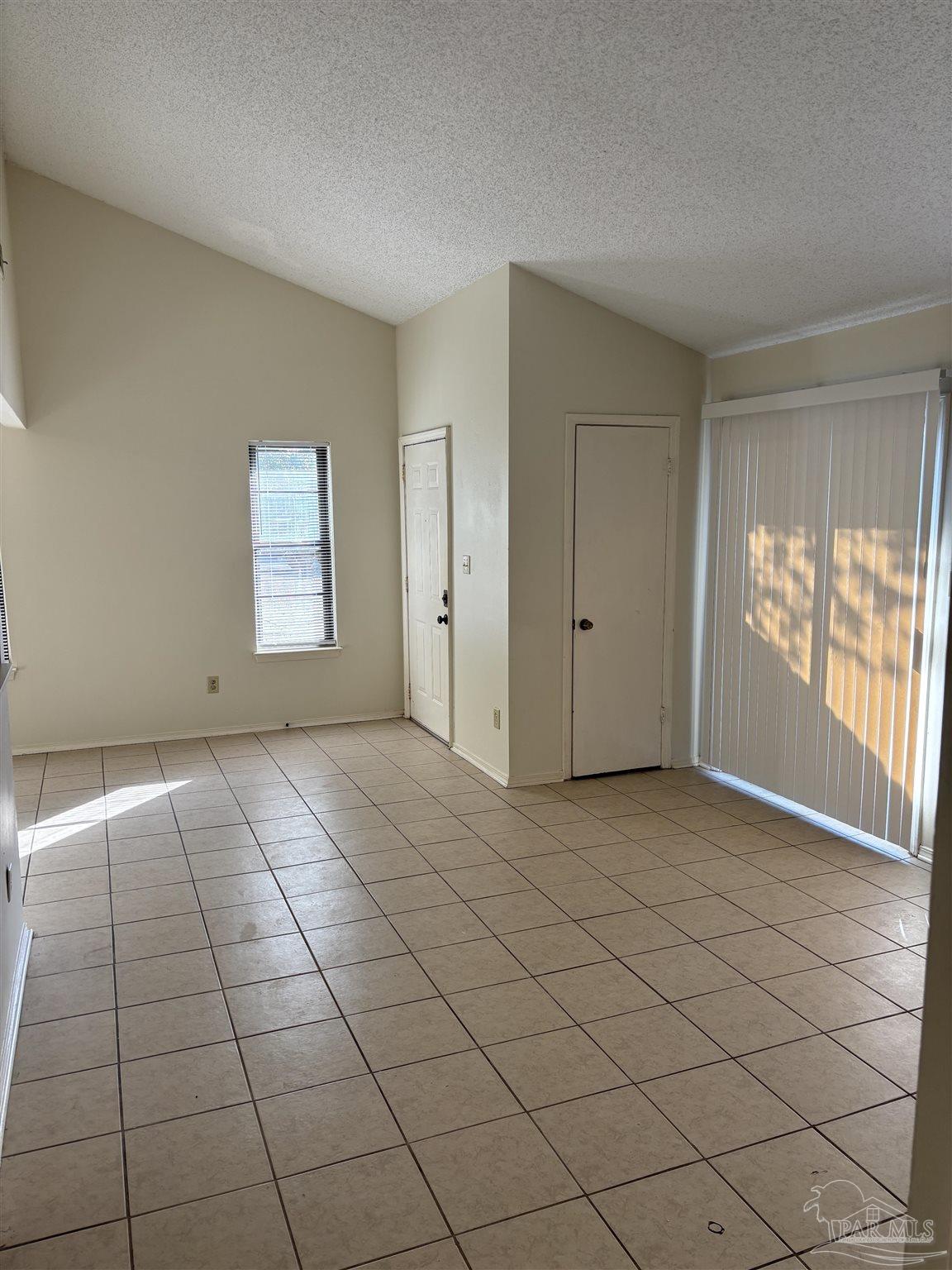 3145 Cedarwood Village Lane Pensacola, FL 32514 - Photo 3 of 11 an empty room with windows