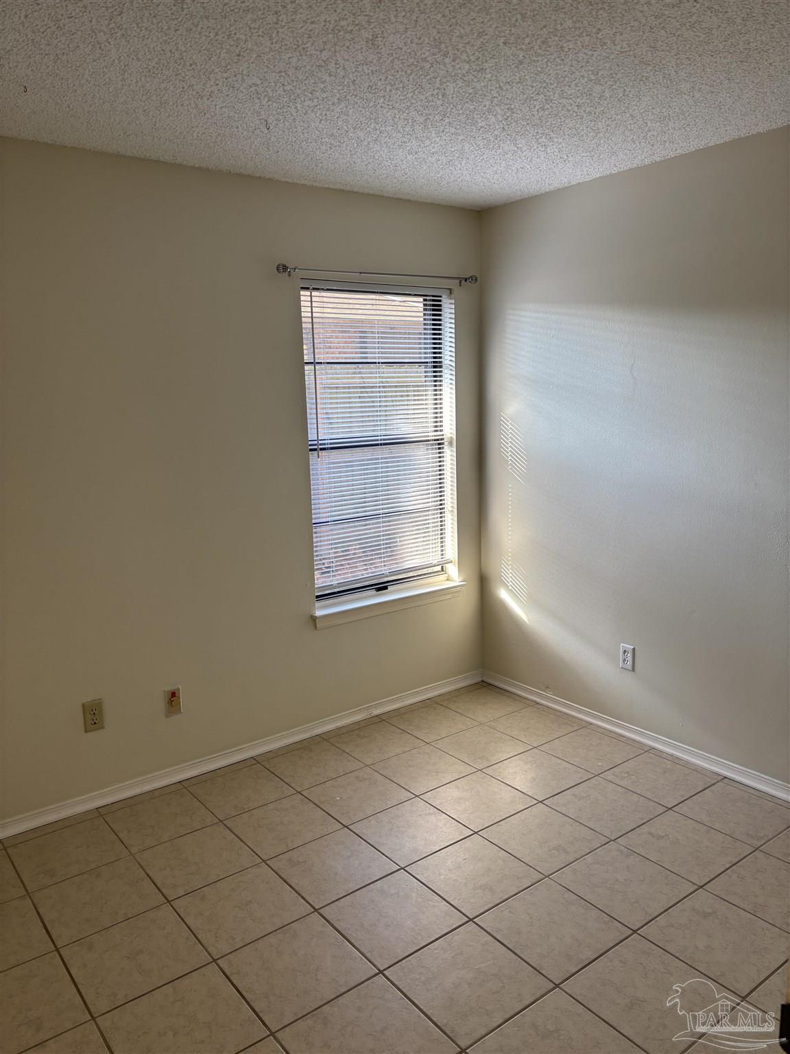 3145 Cedarwood Village Lane Pensacola, FL 32514 - Photo 9 of 11 a view of an empty room with a window