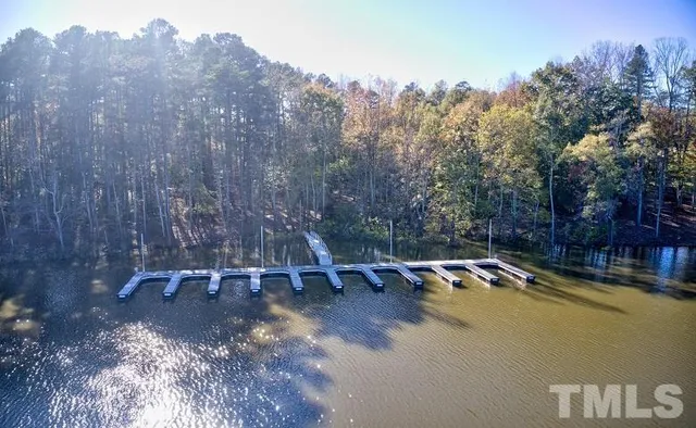 a view of outdoor space with swimming pool and trees