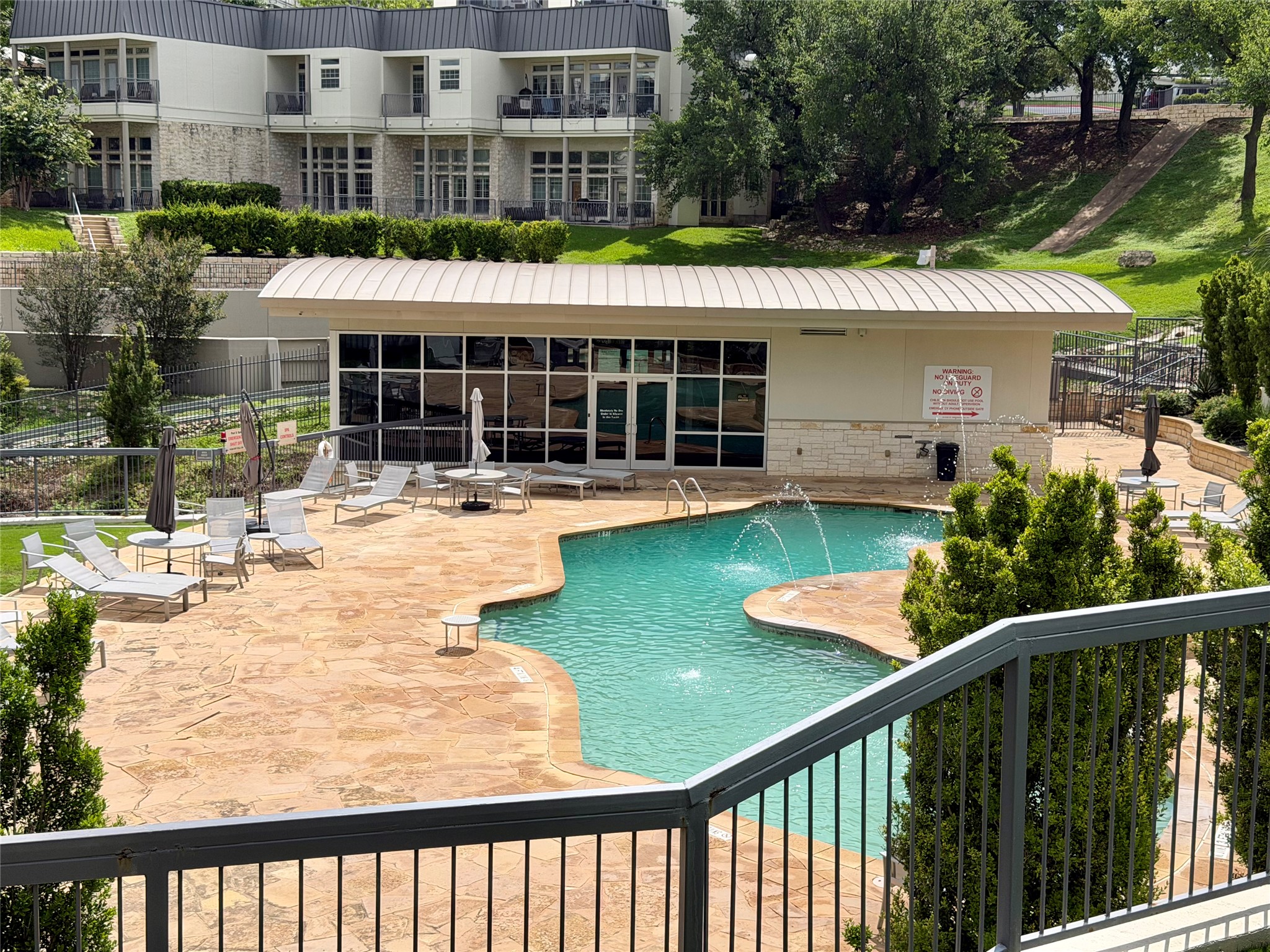 2918 Ranch Road 620 North, Unit C120 Austin, TX 78734 - Photo 27 of 34 A sparkling pool within several feet from your condo has ample lounging areas offer a private oasis for residents.