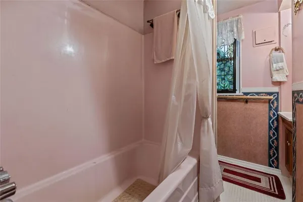 a bathroom with a shower and a tub