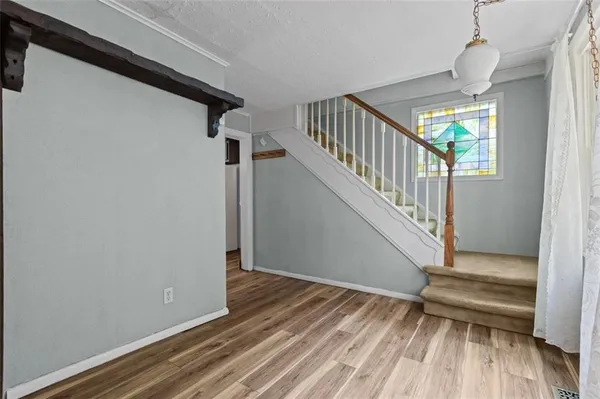 a view of entryway with wooden floor