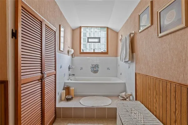 a bathroom with a bathtub and a shower