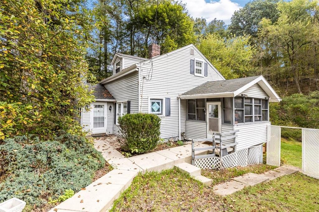 5879 Steele Road Murrysville, PA 15668 - Photo 2 of 27 a front view of house with yard outdoor seating and barbeque oven