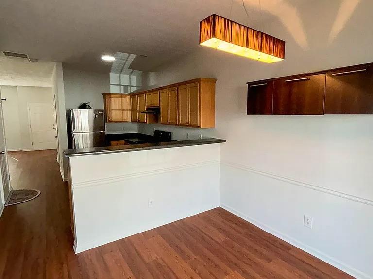 1493 Ashley Way Atlanta, GA 30344 - Photo 2 of 10 a kitchen with stainless steel appliances a refrigerator and a microwave