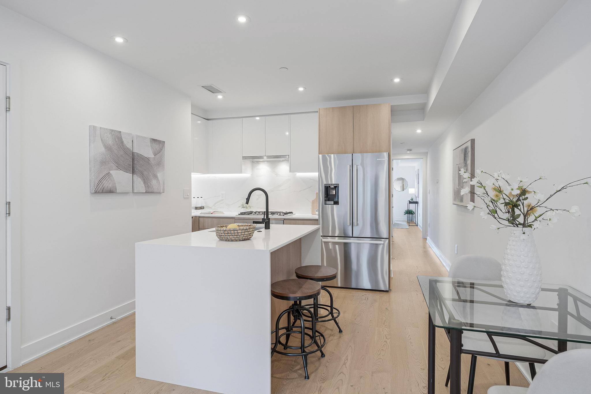 4017 Davis Place Northwest, Unit 6 Washington, DC 20007 - Photo 6 of 17 a kitchen with a sink appliances and cabinets