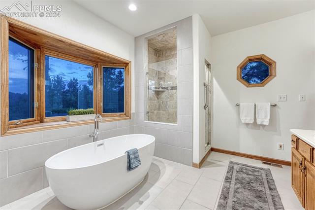 14645 Sterling Road Colorado Springs, CO 80921 - Photo 20 of 49 Enjoy the view while relaxing in the elegant spa like soaking tub