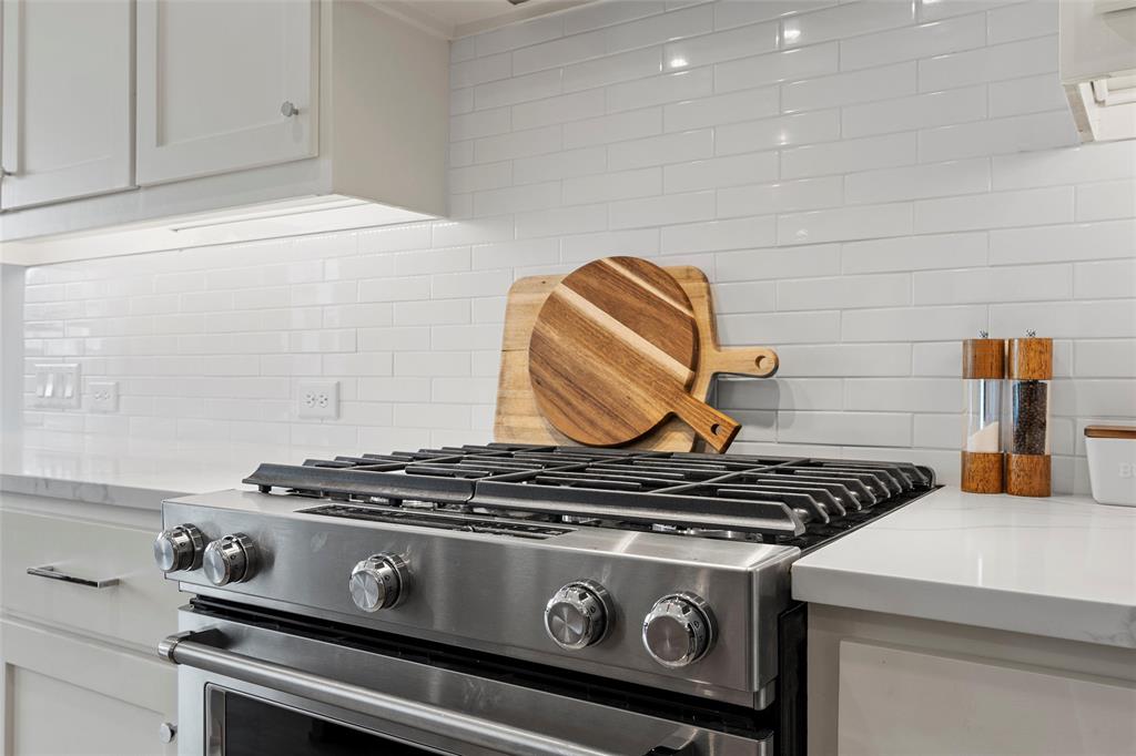 12014 Kenai Circle Woodway, TX 76712 - Photo 14 of 39 a stove top oven sitting inside of a kitchen