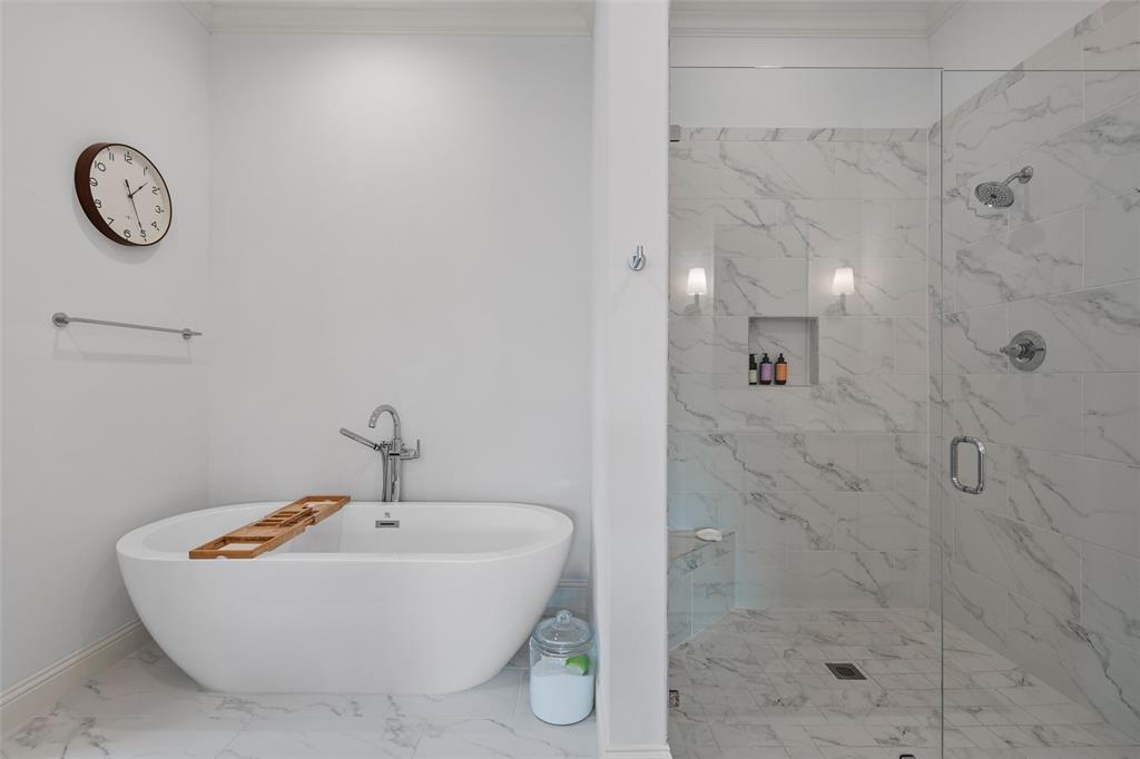 12014 Kenai Circle Woodway, TX 76712 - Photo 21 of 39 a bathroom with a bathtub and a shower