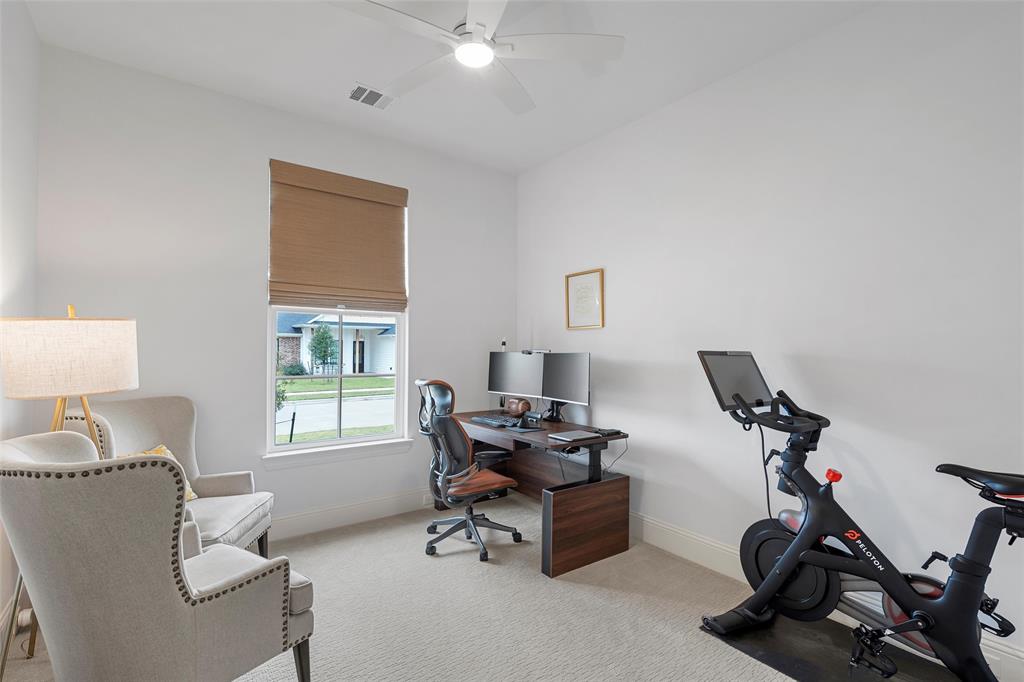 12014 Kenai Circle Woodway, TX 76712 - Photo 24 of 39 a view of a workspace with furniture and a window