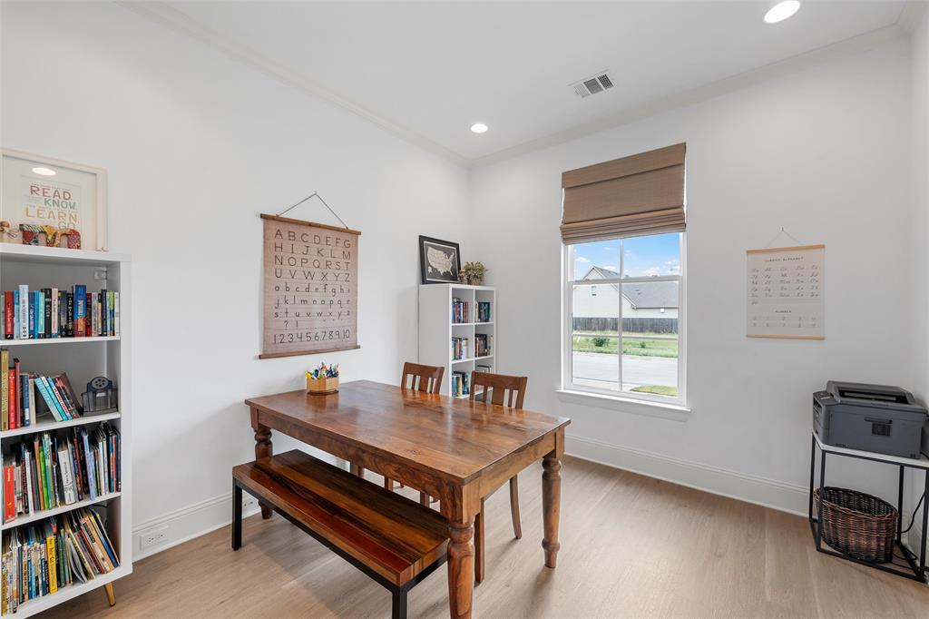 12014 Kenai Circle Woodway, TX 76712 - Photo 25 of 39 a living room with furniture and a book shelf