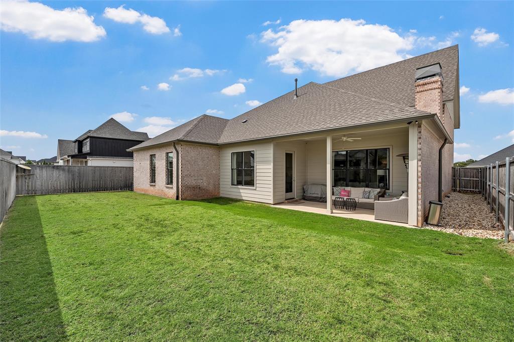 12014 Kenai Circle Woodway, TX 76712 - Photo 35 of 39 a view of a house with a backyard and porch