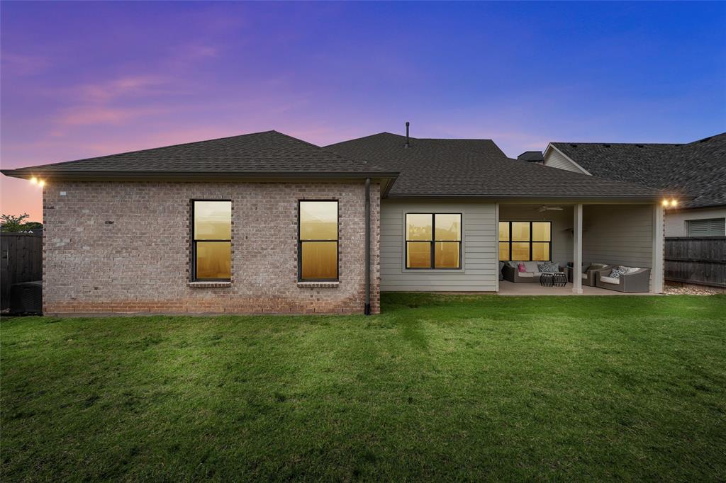 12014 Kenai Circle Woodway, TX 76712 - Photo 39 of 39 a front view of a house with a yard