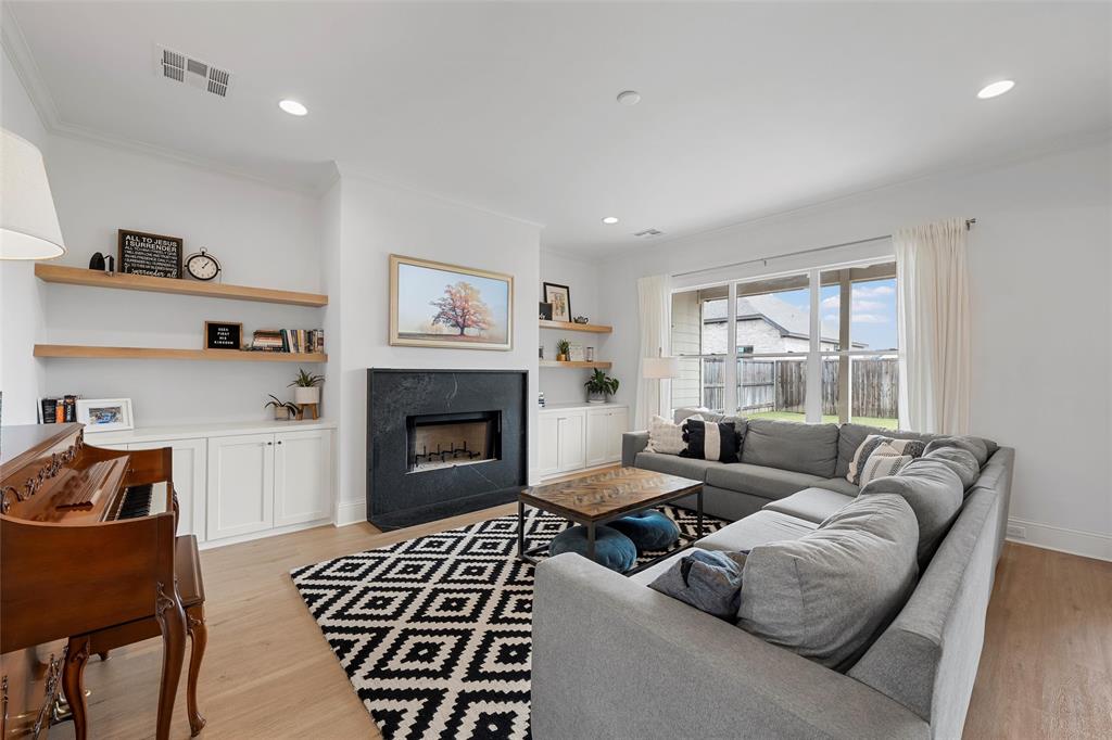12014 Kenai Circle Woodway, TX 76712 - Photo 5 of 39 a living room with furniture and a fireplace