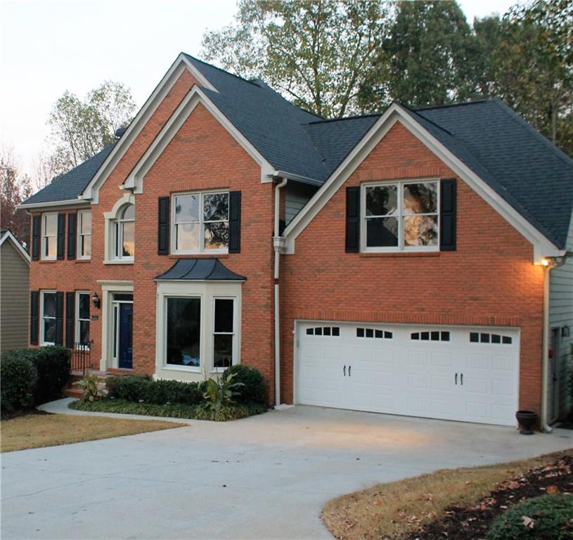 7060 Hunters Ridge Woodstock, GA 30189 - Photo 1 of 1 Front facade of this home shows off its new garage door.