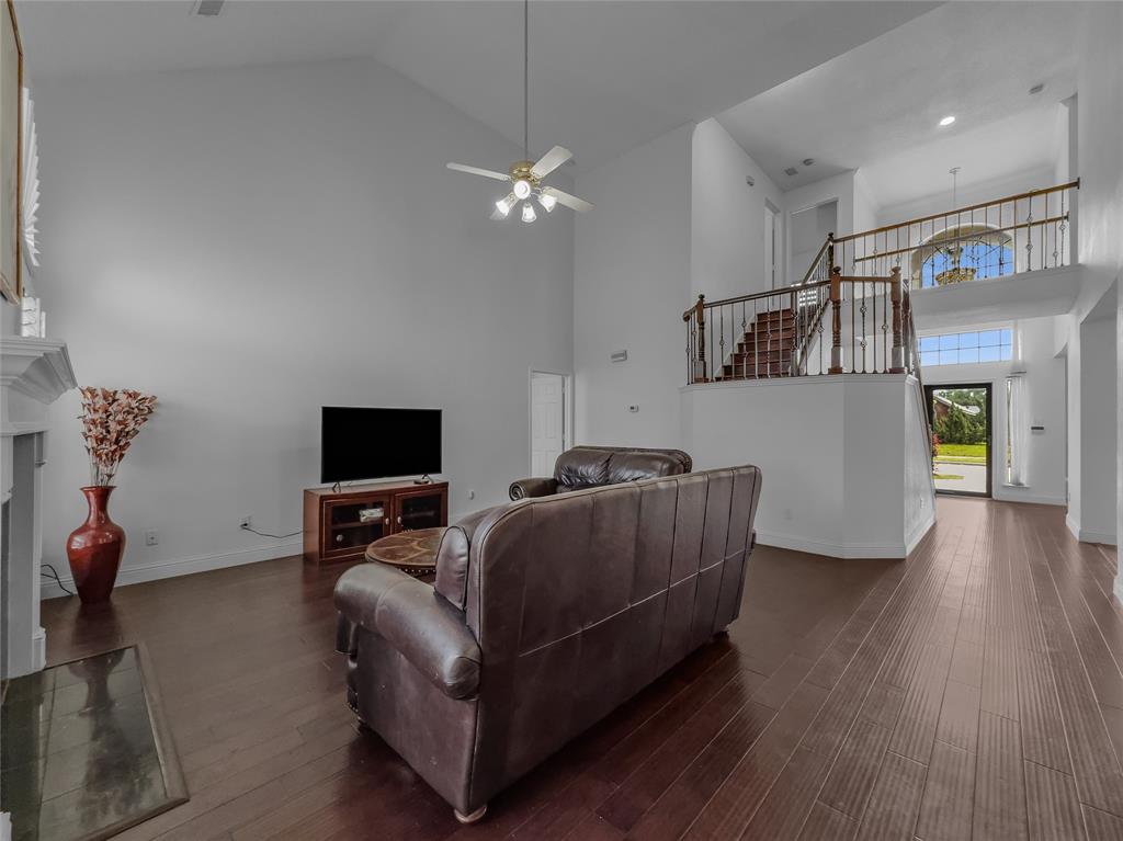 2317 Wellesly Road Rowlett, TX 75089 - Photo 13 of 39 a living room with furniture and a flat screen tv