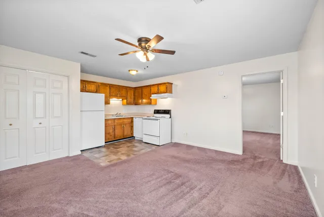 a view of a kitchen with a sink and a kitchen view