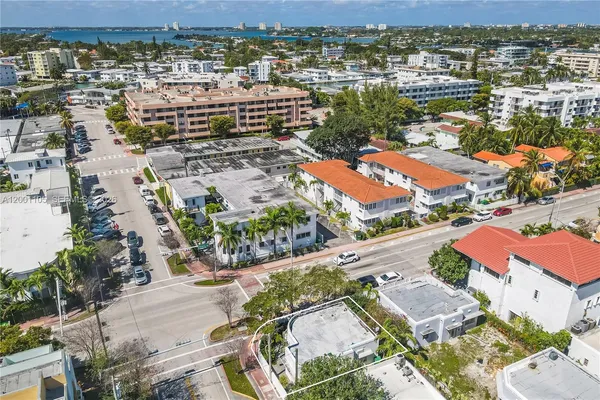 an aerial view of residential building and ocean