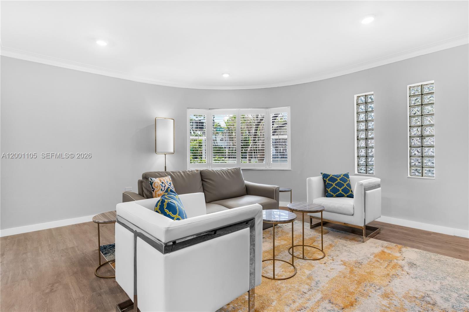 8101 Harding Avenue Miami Beach, FL 33141 - Photo 4 of 34 a living room with furniture and a large window