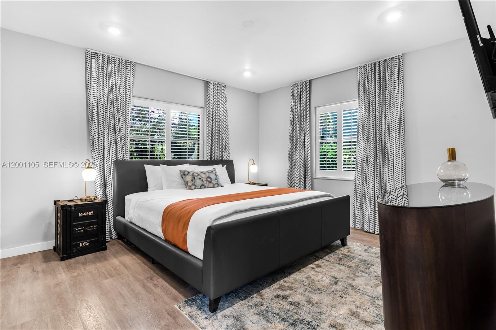 8101 Harding Avenue Miami Beach, FL 33141 - Photo 9 of 34 a spacious bedroom with a bed and window