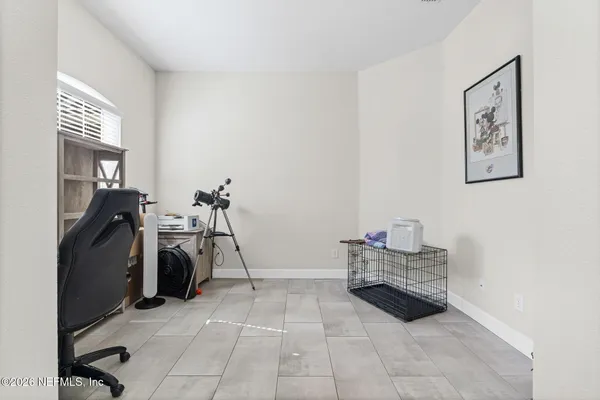a bathroom with a sink a toilet a mirror and shower