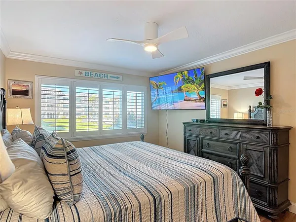a bedroom with a bed and a dresser
