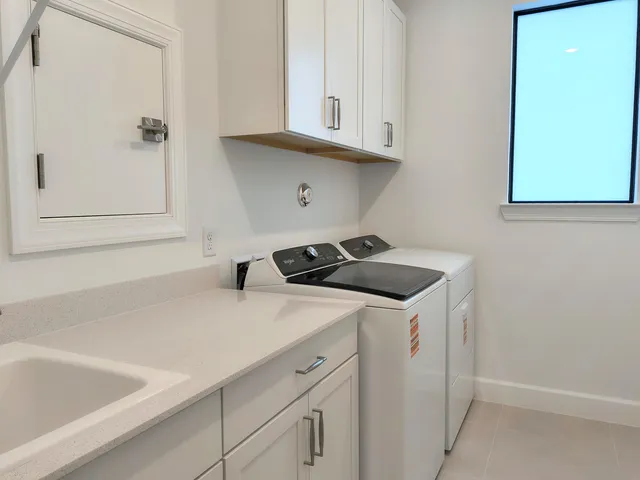 a view of storage and utility room with washer and dryer