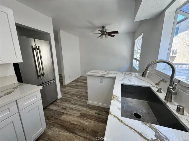 a kitchen with a sink stove and refrigerator