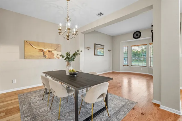 a view of a kitchen with a sink and a refrigerator
