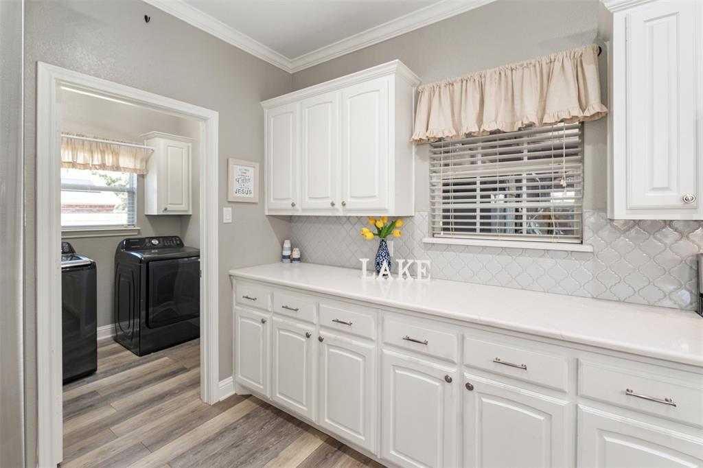 127 Rueda Encina Street Gun Barrel City, TX 75156 - Photo 11 of 39 a kitchen with appliances cabinets and a window