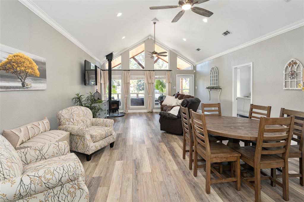 127 Rueda Encina Street Gun Barrel City, TX 75156 - Photo 14 of 39 a living room with furniture chandelier and a large window