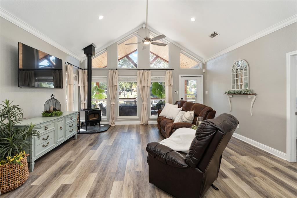 127 Rueda Encina Street Gun Barrel City, TX 75156 - Photo 15 of 39 a living room with furniture a flat screen tv and wooden floor