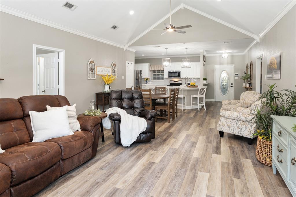 127 Rueda Encina Street Gun Barrel City, TX 75156 - Photo 17 of 39 a living room with furniture and wooden floor