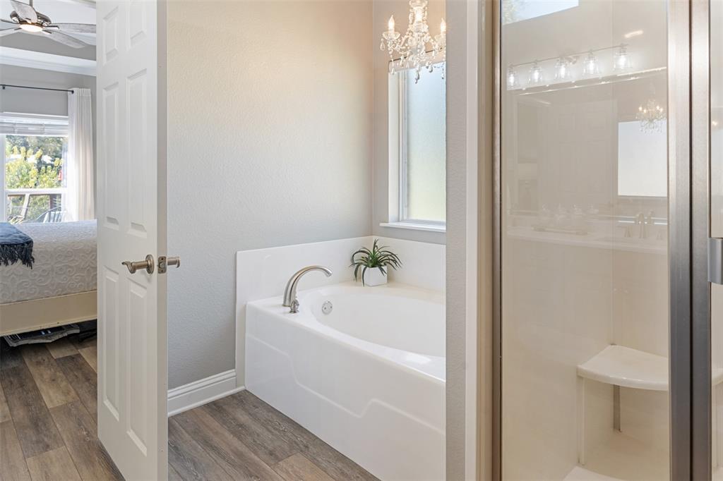 127 Rueda Encina Street Gun Barrel City, TX 75156 - Photo 24 of 39 a white bath tub sitting next to a white sink