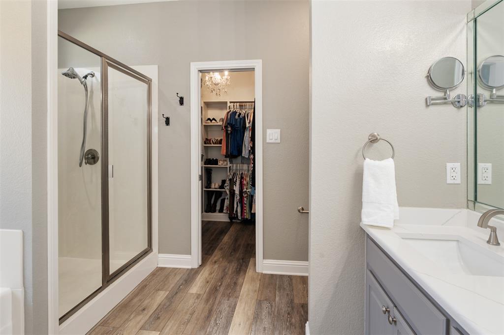 127 Rueda Encina Street Gun Barrel City, TX 75156 - Photo 25 of 39 a bathroom with a sink and a mirror