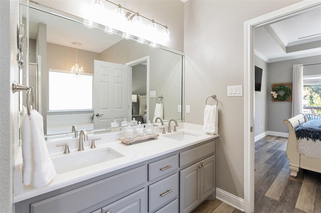 127 Rueda Encina Street Gun Barrel City, TX 75156 - Photo 27 of 39 a bathroom with a double vanity sink mirror and double