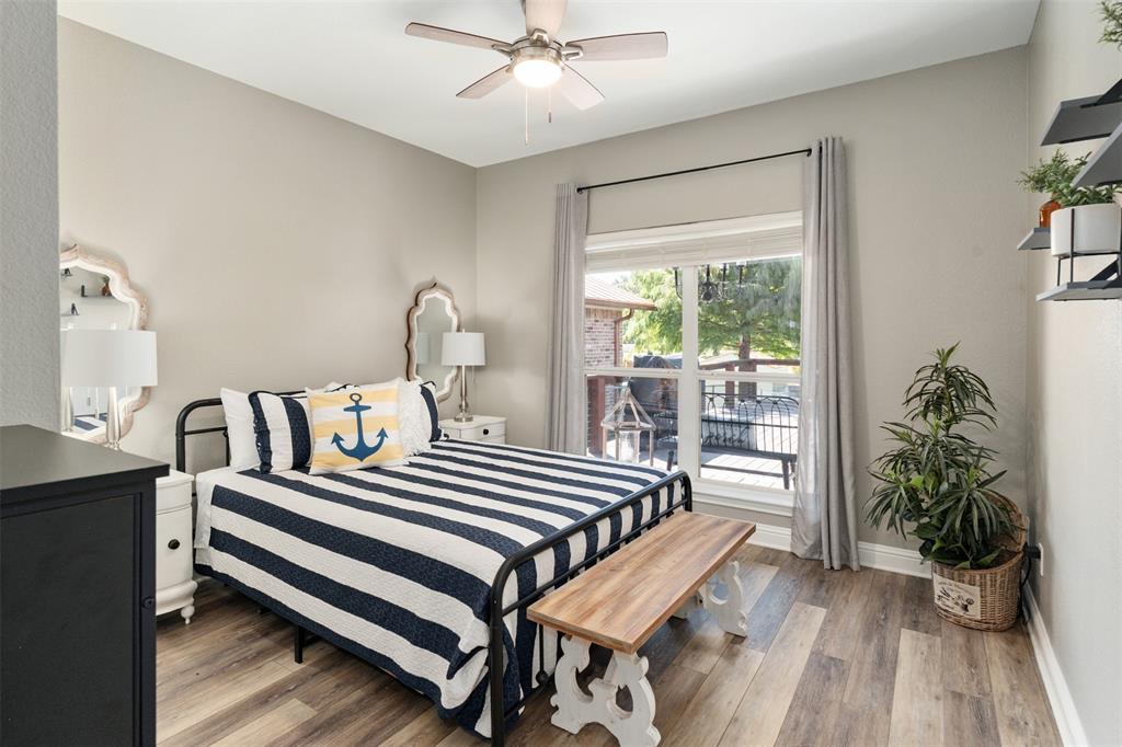 127 Rueda Encina Street Gun Barrel City, TX 75156 - Photo 28 of 39 a view of a bedroom with furniture and wooden floor