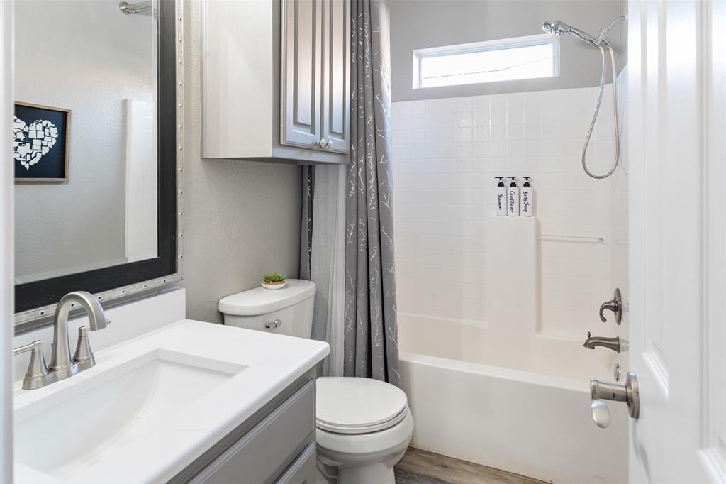 127 Rueda Encina Street Gun Barrel City, TX 75156 - Photo 29 of 39 a bathroom with a sink a toilet and shower