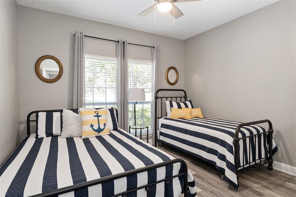 127 Rueda Encina Street Gun Barrel City, TX 75156 - Photo 30 of 39 a bedroom with a bed and a window